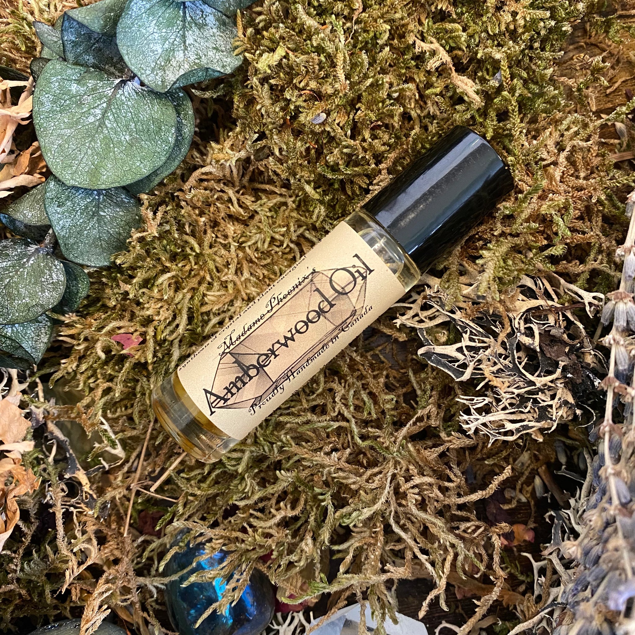 Amberwood roll on crystal aromatherapy blend – Madame Phoenix Online