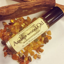 Load image into Gallery viewer, Amberwood roll on crystal aromatherapy blend
